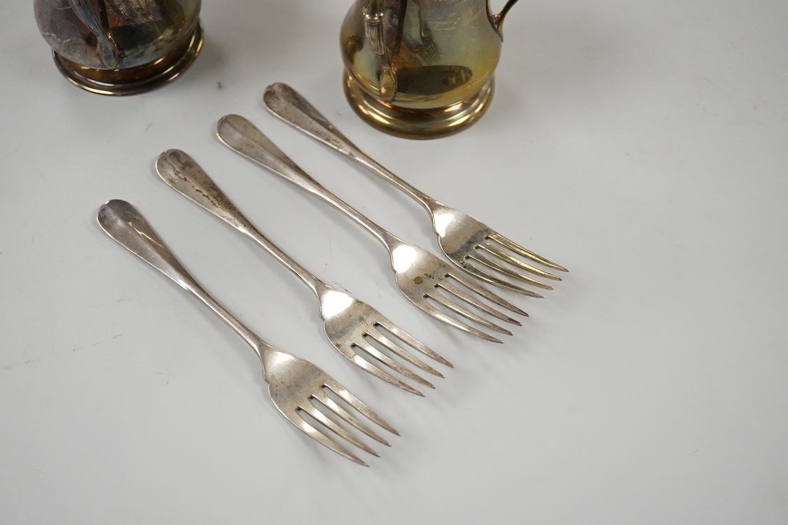 Two George V silver loving cups, one by Atkin Brothers, Sheffield, 1926, height 89mm and a set of four silver Hanoverian pattern dessert forks, Birmingham, 1930, 16.4oz.